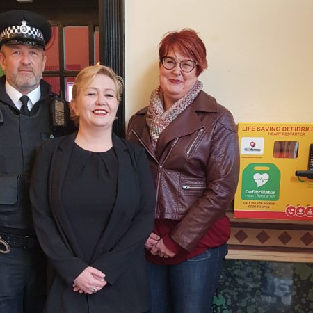 Southport Business Improvement District (Southport BID) has worked with Merseyside Police and local businesses to place a defibrillator, which will be available 24 hours a day, at The Scarisbrick Hotel on Lord Street in Southport. Pictured are (from left): PC Walker from Merseyside Police; Scarisbrick Hotel bars manager Katie Howard; and Southport BID Chair Susannah Porter.
