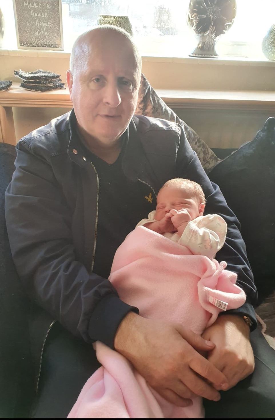 Garry Melia, from Southport, has died with Covid-19. He is pictured with daughter Sienna, who is eight weeks old. 